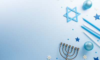 Jewish holiday Hanukkah concept. Top view of  menorah and candles on blue background.