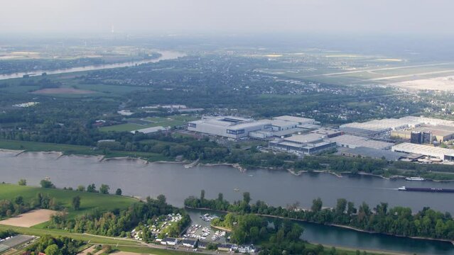 High resolution video from the Messe Duesseldorf, taken from a helicopter. It shows the exhibition including in front of the rhine. In the background is the Airport Duesseldorf.