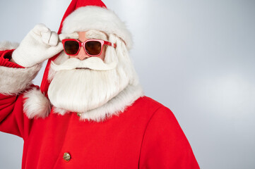 Portrait of santa claus in sunglasses isolated on white background. 