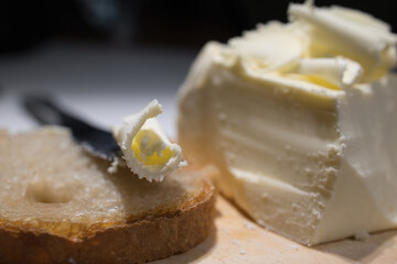 Cutting butCutting butter spread in sunlight shot close upter spread in sunlight shot close up