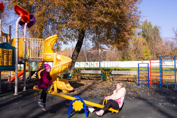 Girls play on the playground.