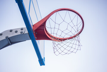 A modern outdoor sports ground. A basketball hoop. 2023 