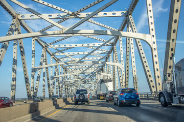 cars crossing the Mississippi at Baton Rouge at the old historic Horace Wilkinson bridge in Baton Rouge, Louisiana