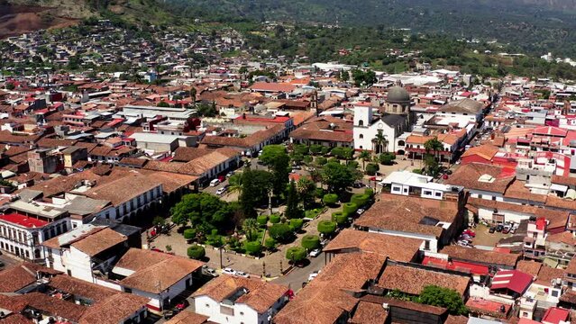 DRONE SHOT OF TACAMBARO MICHOACAN MAIN PLAZA AT MID DAY