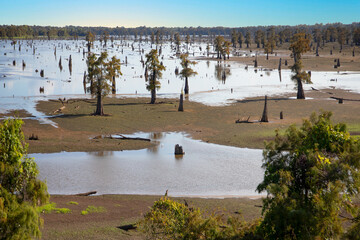 Lake Bigeaux under blue skies and white clouds in Louisiana