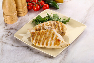 Grilled chicken breast served arugula