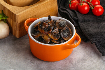 Roasted champignon mushrooms in the bowl