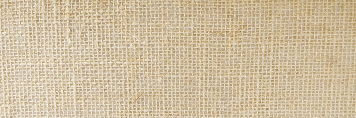 Hessian sackcloth woven texture pattern background in light cream beige brown color