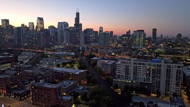 Drone hyperlapse over the streets of River West and Fulton River, dusk in Chicago