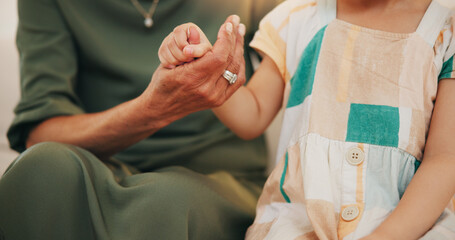 Child, grandmother and hand closeup as care safety or love together for bonding, protection or...