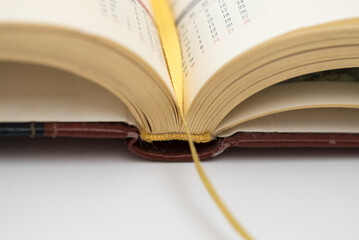Open paper business planner closeup