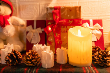 Beautiful Christmas gift boxes on floor near fir tree in room.