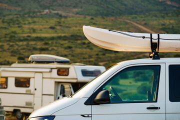 Canoe on roof top of car van