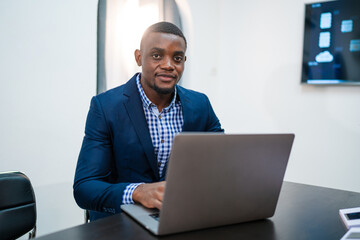 Closeup of businessman working at office, Man hands typing keyboard on laptop or computer.	
