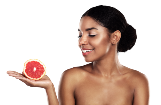 Happy woman, skincare and grapefruit for beauty, cosmetics, natural product and vitamin c on her palm. African person or model with red fruit for dermatology isolated on a transparent, PNG background - Powered by Adobe