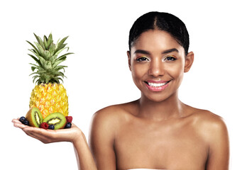 Happy woman, skincare and pineapple for beauty, cosmetics, natural product and vitamin c on her...
