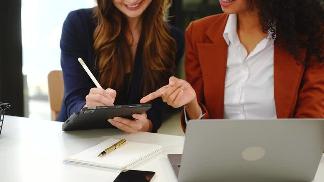 Two professional caucasian with african american businesswoman friends collaboration, working together at office, using laptop, Generally accepted audit standards, Earnings before interest and taxes