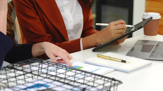 Two professional caucasian with african american businesswoman friends collaboration, working together at office, using laptop, Generally accepted audit standards, Earnings before interest and taxes