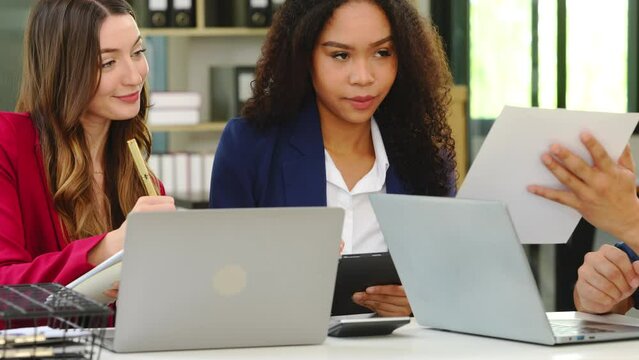 Two professional caucasian with african american businesswoman friends collaboration, working together at office, using laptop, Generally accepted audit standards, Earnings before interest and taxes