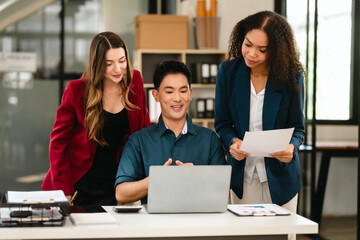 Professional team of caucasian and african american business women and asian man working together, papers, laptop, in office, Invoice, Job order cost system, Investing activities, interest expenses