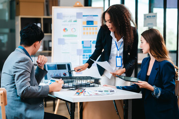 diverse team of professionals engaged in a website graphic design board meeting, sharing opinions on UX and UI design elements. Asian man, African American people, black, afro, caucasian female