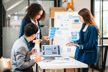 diverse team of professionals engaged in a website graphic design board meeting, sharing opinions...