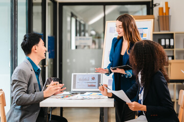 diverse team of professionals engaged in a website graphic design board meeting, sharing opinions on UX and UI design elements. Asian man, African American people, black, afro, caucasian female