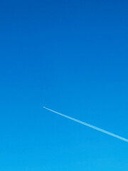 Blue sky with airplane as background