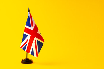 Flag of Great Britain Union Jack on flagpole studio shot