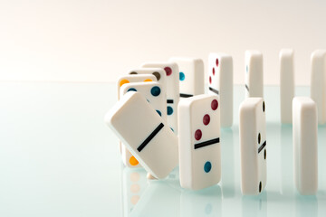 Domino tiles in a row on white background
