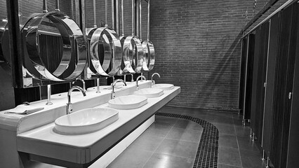 Row of public toilet modern design interior, Modern Public Restroom, lavatory, water closet and...