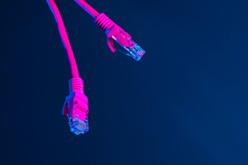 Modern technology network cable in neon light.