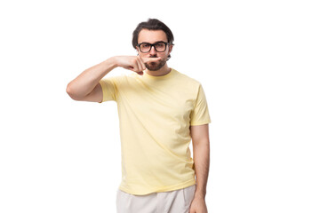 young caucasian man with black hair and beard shows grimace