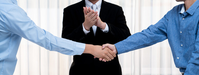 Corporate attorney applaud as business people seal a successful deal or agreement with handshake, celebrating mutually beneficial acquisition. Business handshaking concept. Panorama Rigid - obrazy, fototapety, plakaty