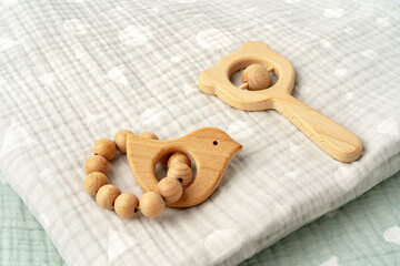 Baby muslin blanket and wooden toys for newborn