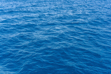 Seascape from high perspective. Top view of ocean sea water splashing.