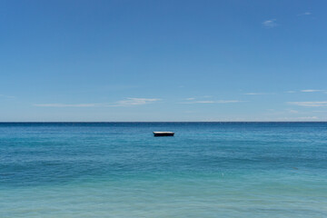 Resort swim lay float on wooden raft. A wooden raft for sunbathing on water.