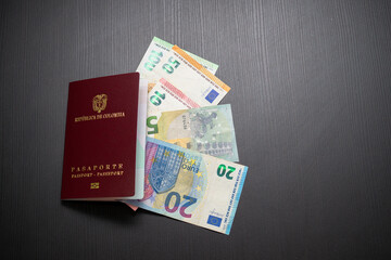 wide shot of Colombian passport with euro bills