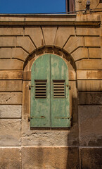 Old wooden shutters in the historic centre of the medieval coastal town of Rovinj in Istria, Croatia