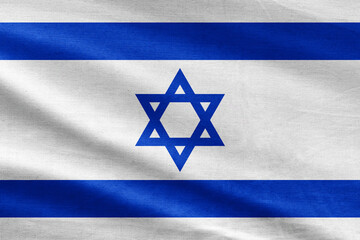 Israeli flag waving in the wind. Close up of Israel banner blowing, soft and smooth silk. Cloth fabric texture ensign background. Use it for national day and country occasions concept.