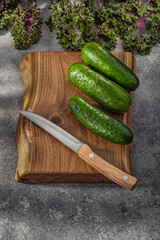Knife On Kitchen Wood And Cucumbers.