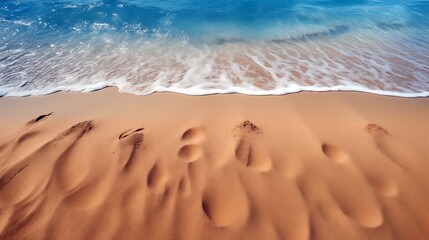 Fototapeta na wymiar footprints in the sand of a beach near the ocean