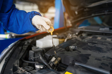 Closeup of auto mechanic are using the wrench to repair and maintenance auto engine is problems at...