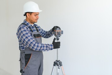 Worker make repairs in new apartment