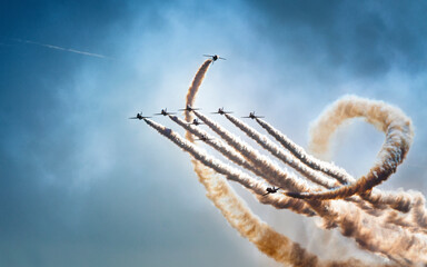 Fototapeta premium Precision Flying: Dynamic Aerobatics at the Airshow