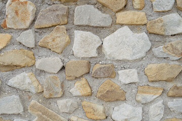 Stonework background. Wall made of stone and concrete