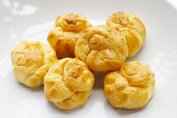 Cream puffs on white background