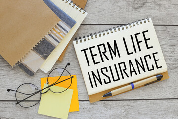 Term life insurance. notepad with pen. text on the page.