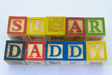 The term sugar daddy visually displayed on a clear background with copy space