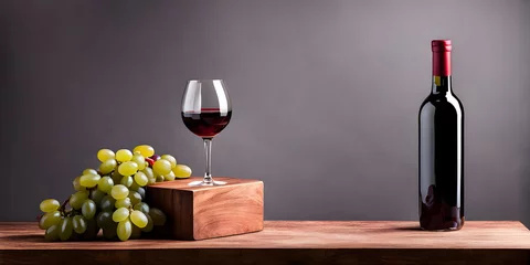 Fotobehang Red wine bottle with wine grapes on black background. © Smile Studio AP